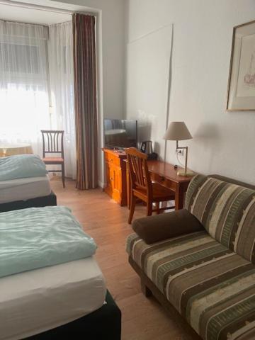 Postel nebo postele na pokoji v ubytování Hotel Am Roonplatz