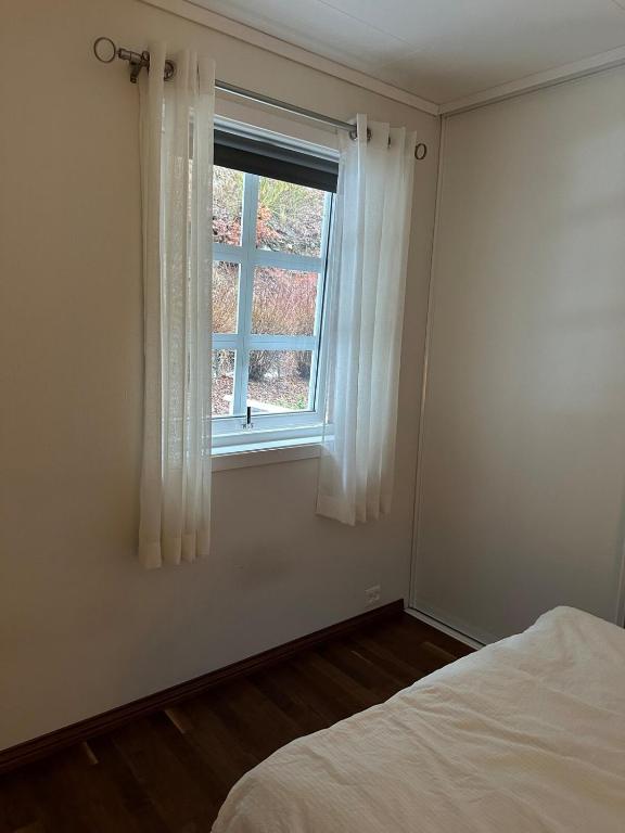 Postel nebo postele na pokoji v ubytování Familievennlig leiligheten leies ut på Sørlandet.