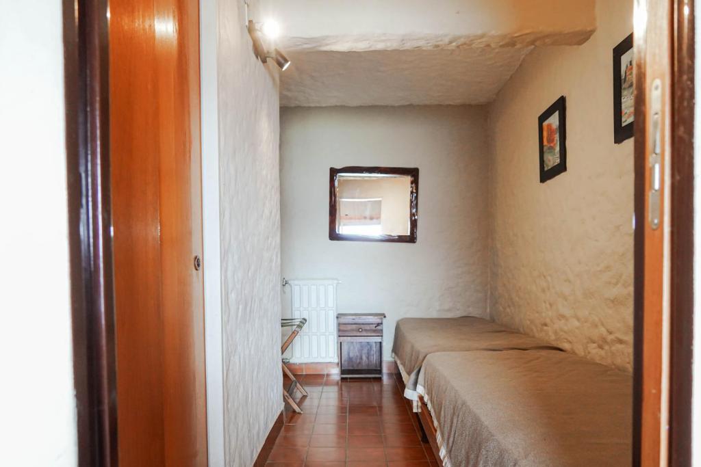 Postel nebo postele na pokoji v ubytování La Caleta Bungalows