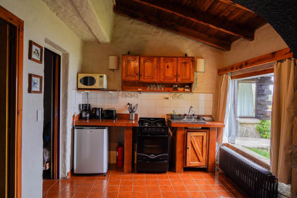 Kuchyň nebo kuchyňský kout v ubytování La Caleta Bungalows