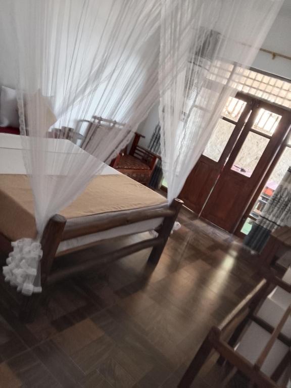 Postel nebo postele na pokoji v ubytování Apurvi Homestay