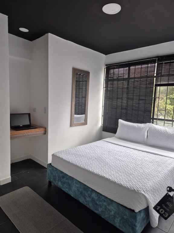 Postel nebo postele na pokoji v ubytování Hotel Capital