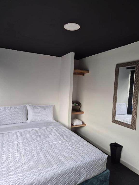 Postel nebo postele na pokoji v ubytování Hotel Capital