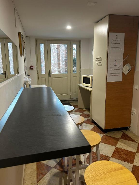 Kuchyň nebo kuchyňský kout v ubytování Collegio AMDG