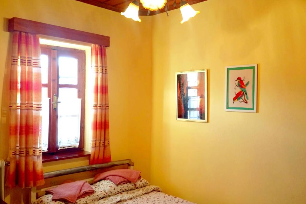 Postel nebo postele na pokoji v ubytování Xenonas Achnoulas
