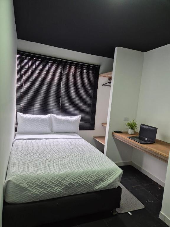 Postel nebo postele na pokoji v ubytování Hotel Capital