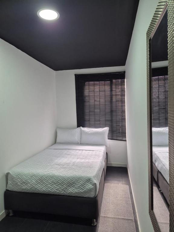 Postel nebo postele na pokoji v ubytování Hotel Capital