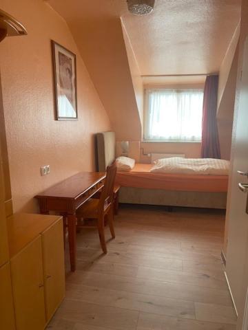 Postel nebo postele na pokoji v ubytování Hotel Am Roonplatz