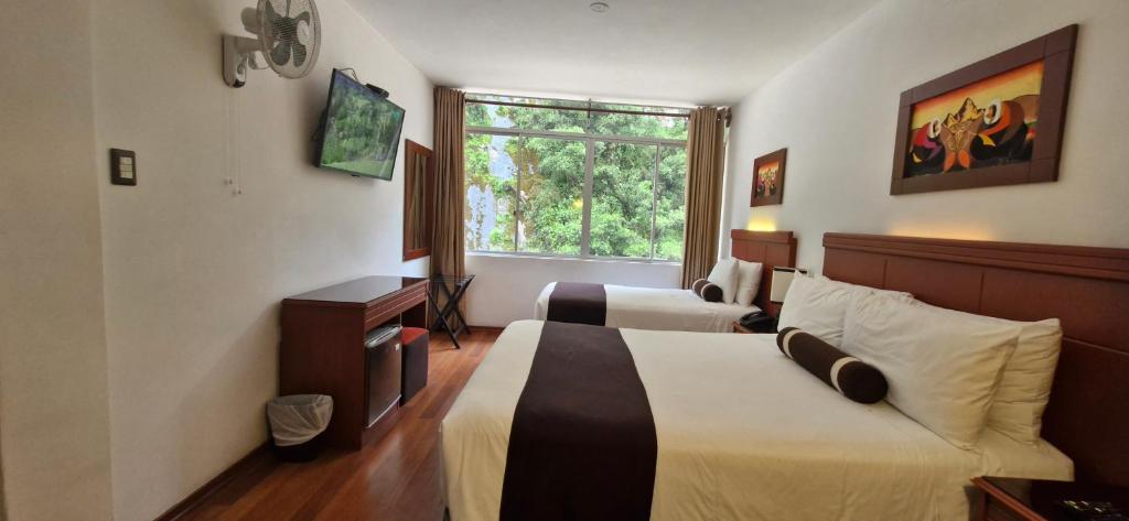 Voodi või voodid majutusasutuse Hotel Ferré Machu Picchu toas