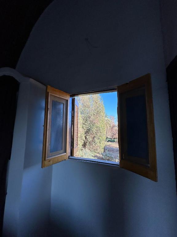 a window in a room with a view at Nubian King in Aswan