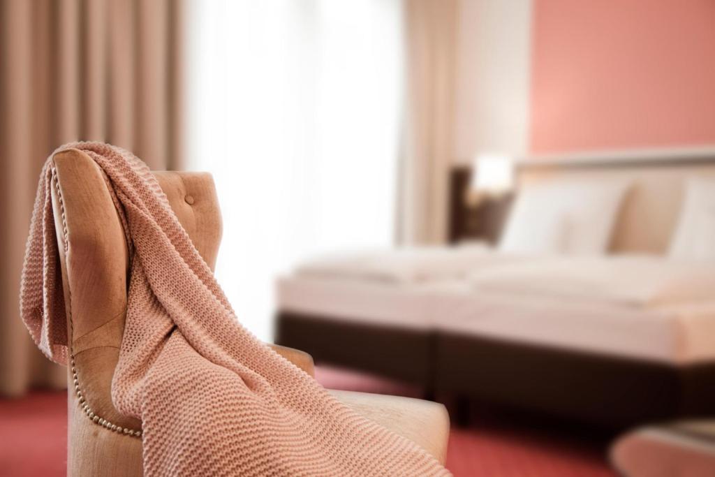 Postel nebo postele na pokoji v ubytování Gold Palais Hotel