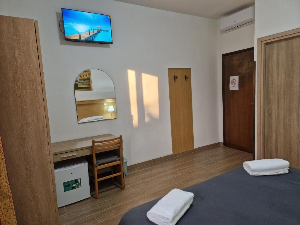 Postel nebo postele na pokoji v ubytování Hotel Tito