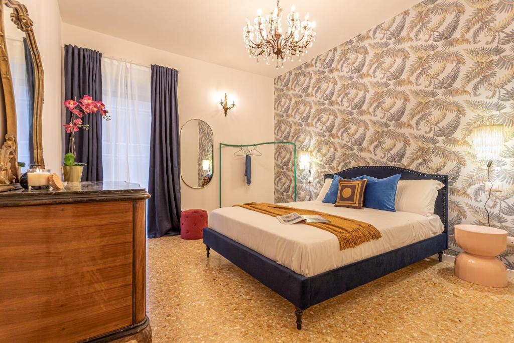 a bedroom with a bed and a dresser and a mirror at YCH-Cozy Flat at the Vatican in Rome