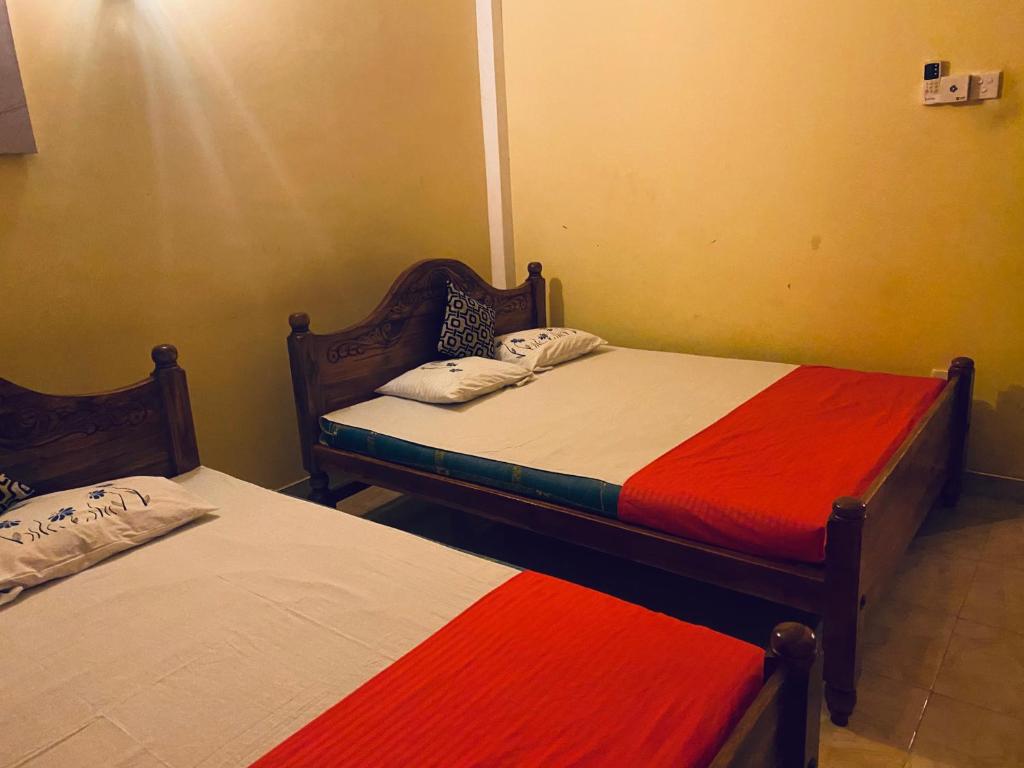 Postel nebo postele na pokoji v ubytování ARI Paradise