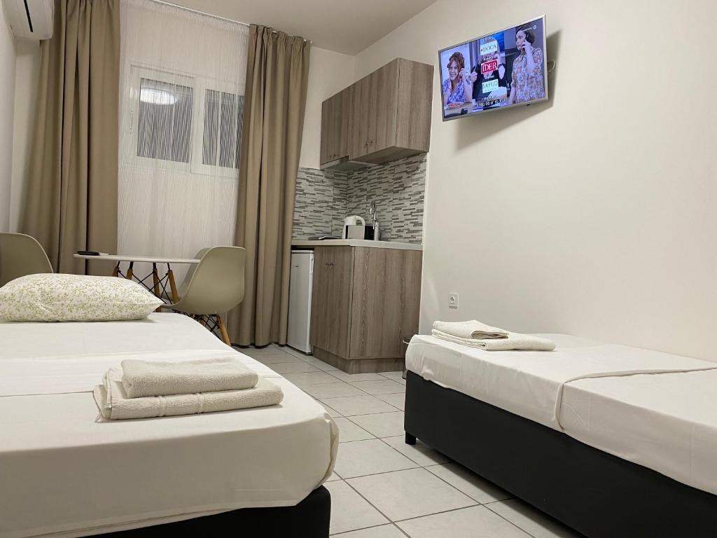 Postel nebo postele na pokoji v ubytování Sunny Beach Potos