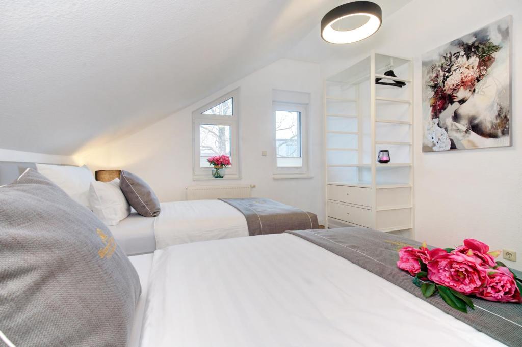 Postel nebo postele na pokoji v ubytování Blumen(t)raum Ferienwohnung 3