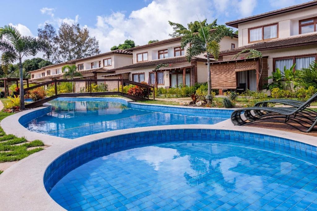 an image of a swimming pool at a house at condominio viva barra barra grande casa 136 in Marau