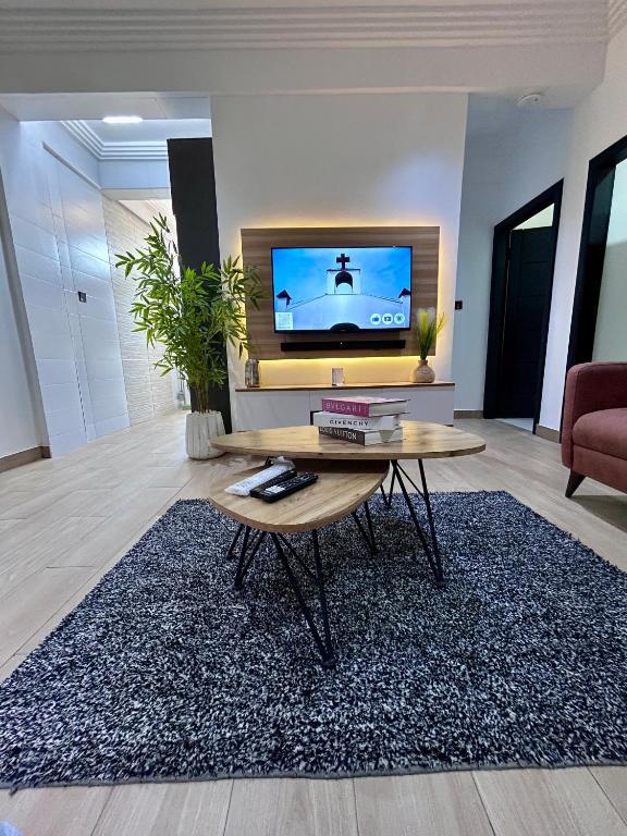 TV a/nebo společenská místnost v ubytování Pebbles Nest