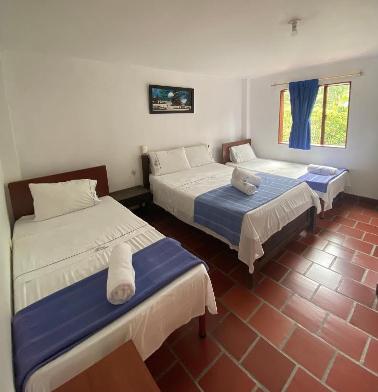 Postel nebo postele na pokoji v ubytování Hotel Davilejas