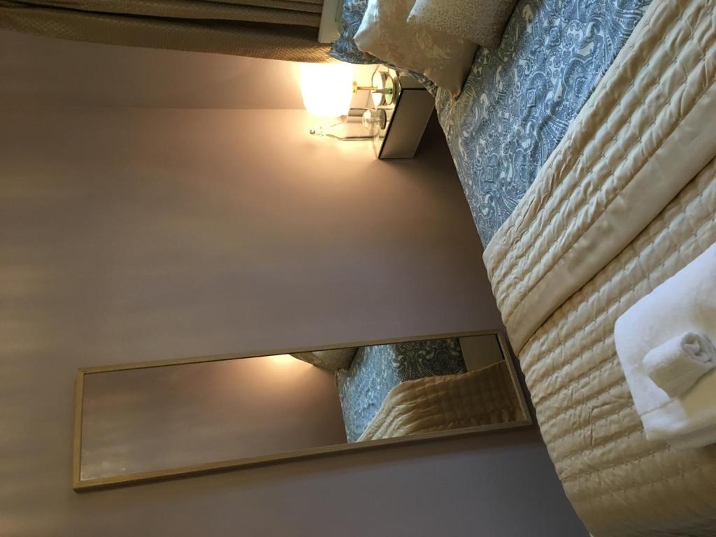 a view of a mirror in a hotel room at Leafy Suburban Bed and Breakfast in Northwood