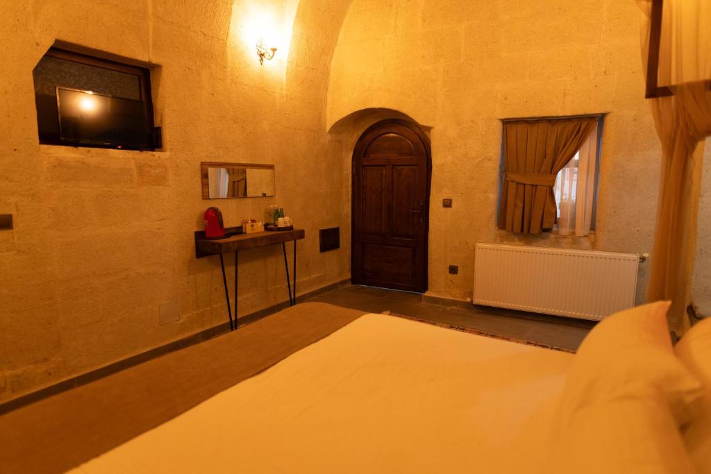 Postel nebo postele na pokoji v ubytování Lemon Cave Suites