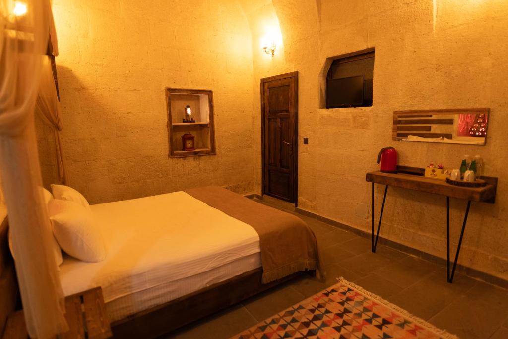 Postel nebo postele na pokoji v ubytování Lemon Cave Suites
