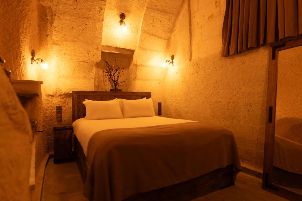 Postel nebo postele na pokoji v ubytování Lemon Cave Suites