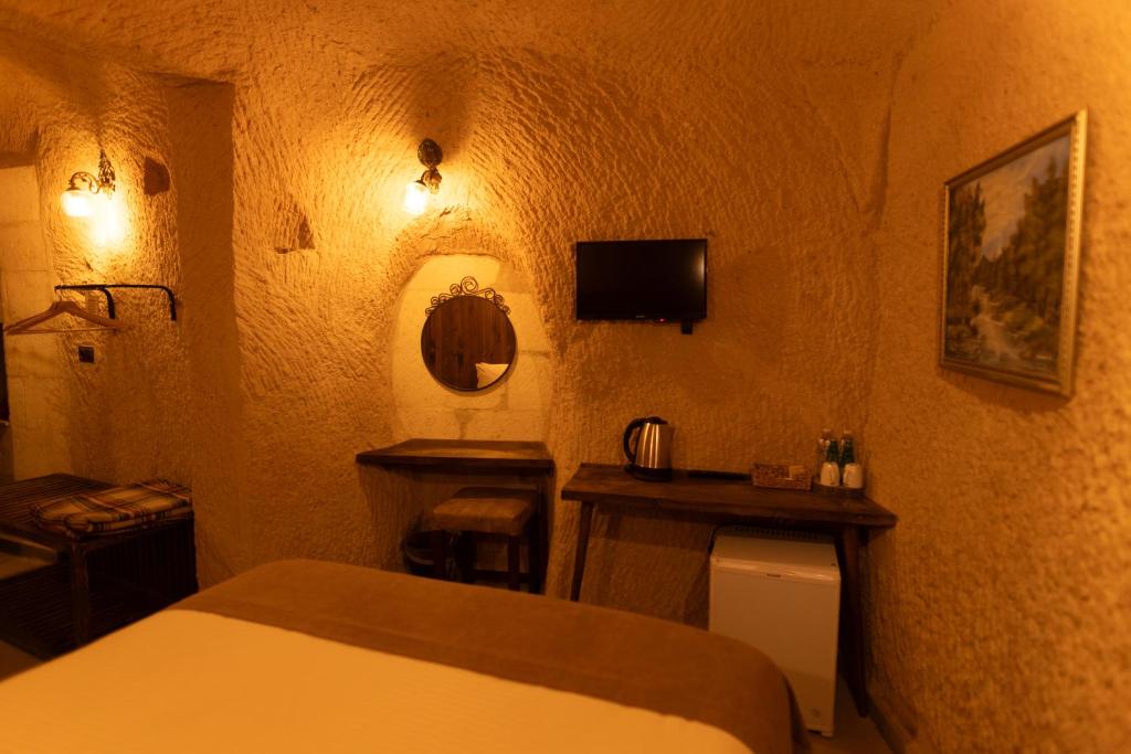 Postel nebo postele na pokoji v ubytování Lemon Cave Suites
