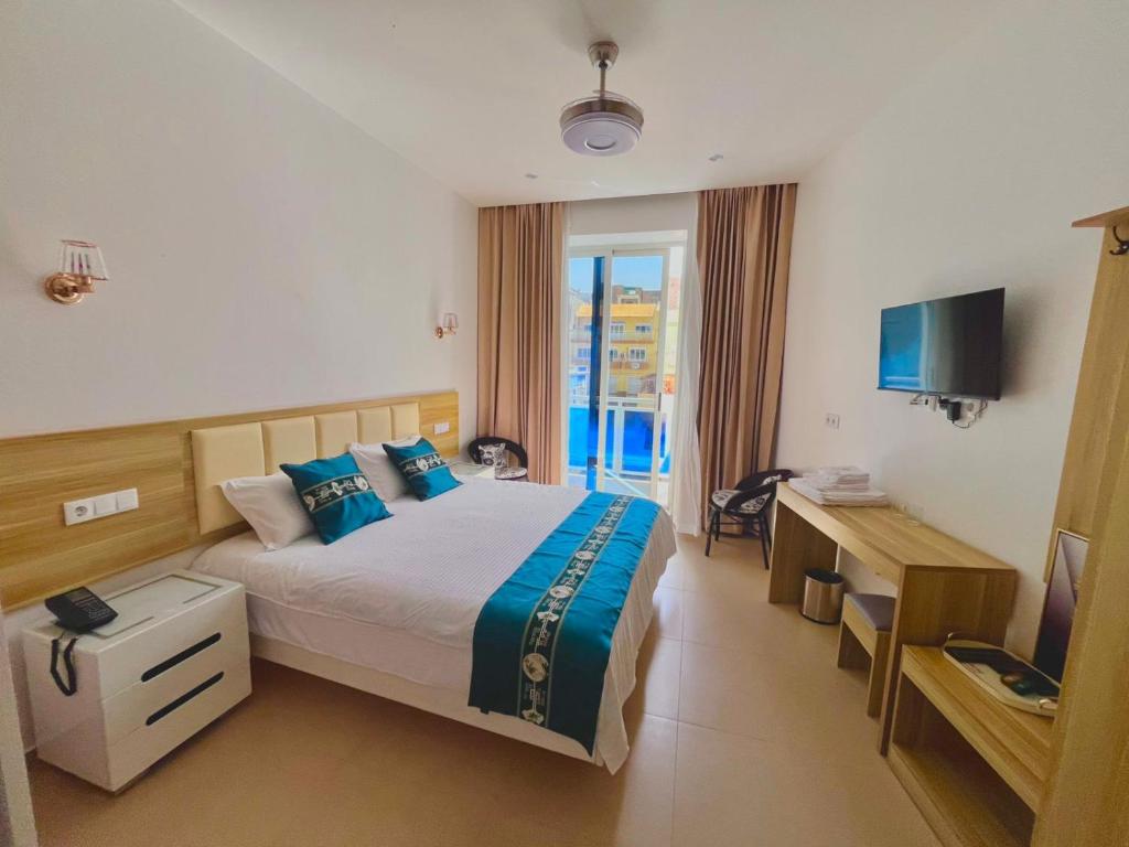 Postel nebo postele na pokoji v ubytování Lily holiday hotel