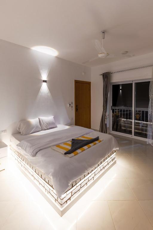 Postel nebo postele na pokoji v ubytování Pharaohs Guest House