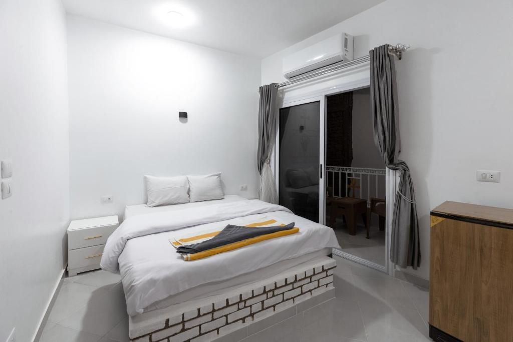 Postel nebo postele na pokoji v ubytování Pharaohs Guest House