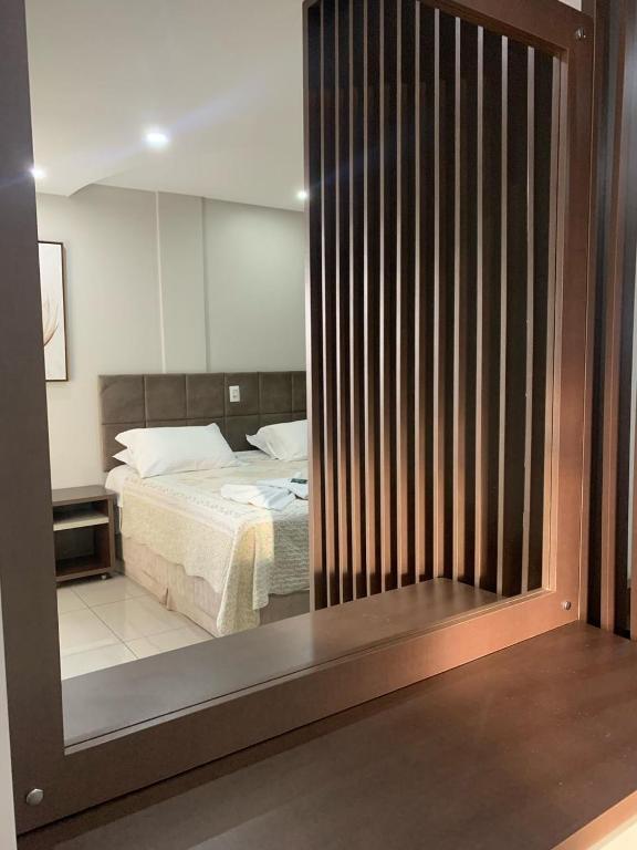 Postel nebo postele na pokoji v ubytování Prudentópolis Palace Hotel