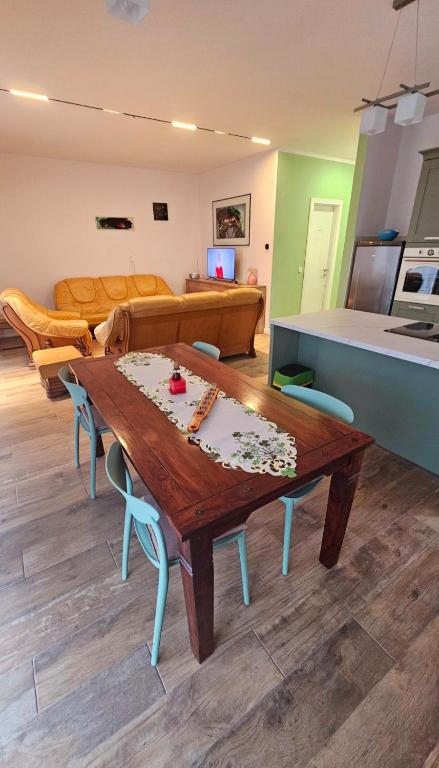 a living room with a table and a couch at festina lente in Osijek