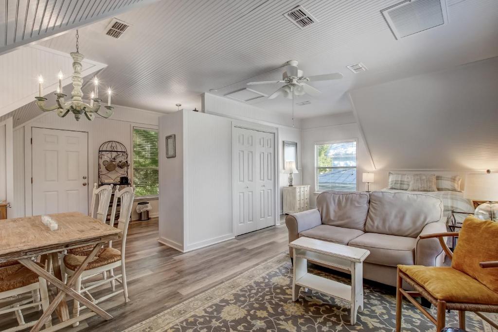 a living room with a couch and a table at Adorable Dog Friendly Garage Apartment in the Historic District of Old Town in Fernandina Beach