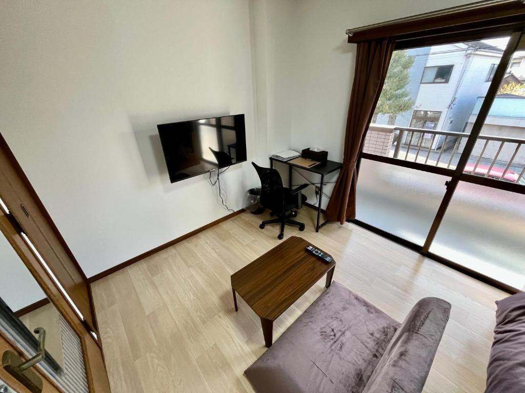 TV a/nebo společenská místnost v ubytování Apartment Hotel Kuki