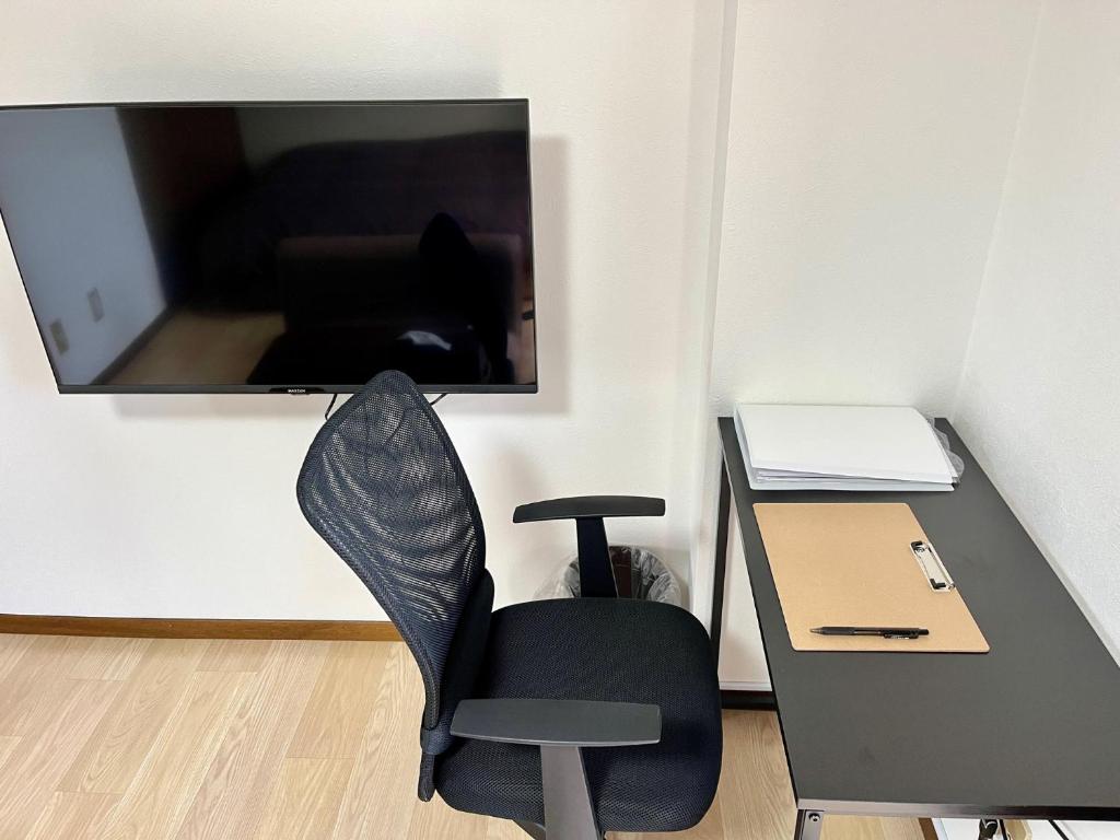 TV a/nebo společenská místnost v ubytování Apartment Hotel Kuki