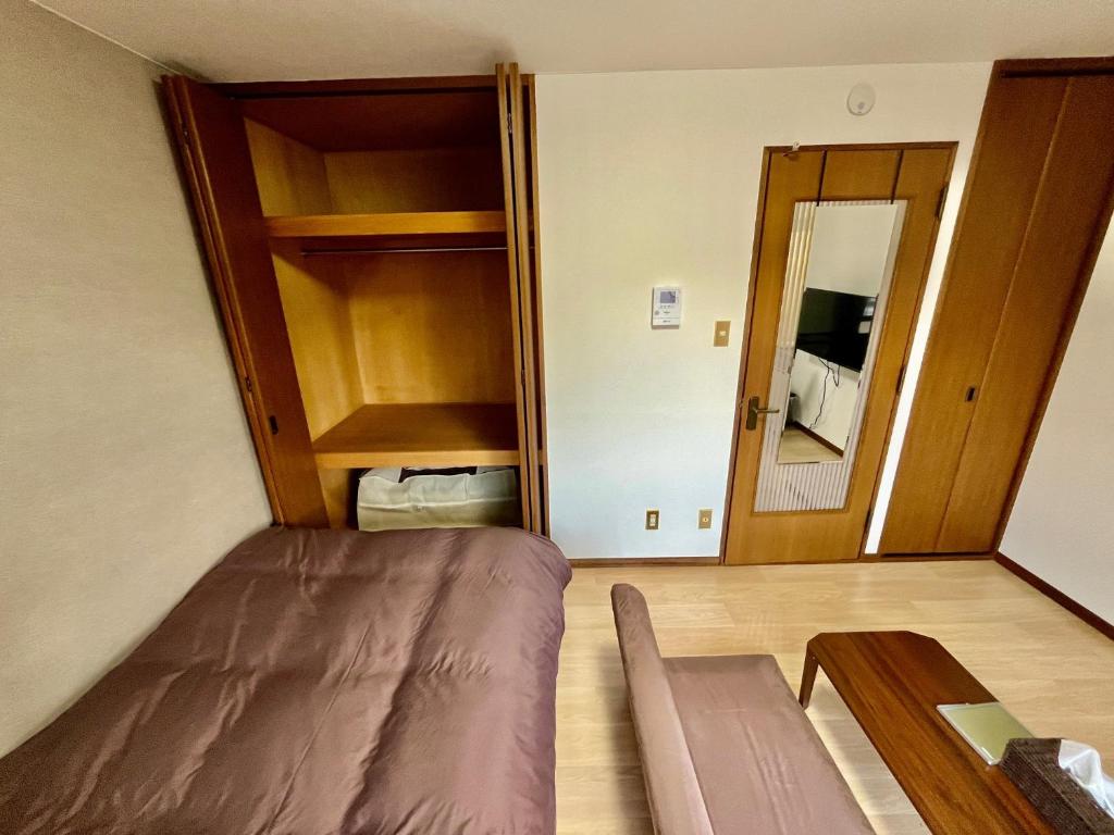 Postel nebo postele na pokoji v ubytování Apartment Hotel Kuki