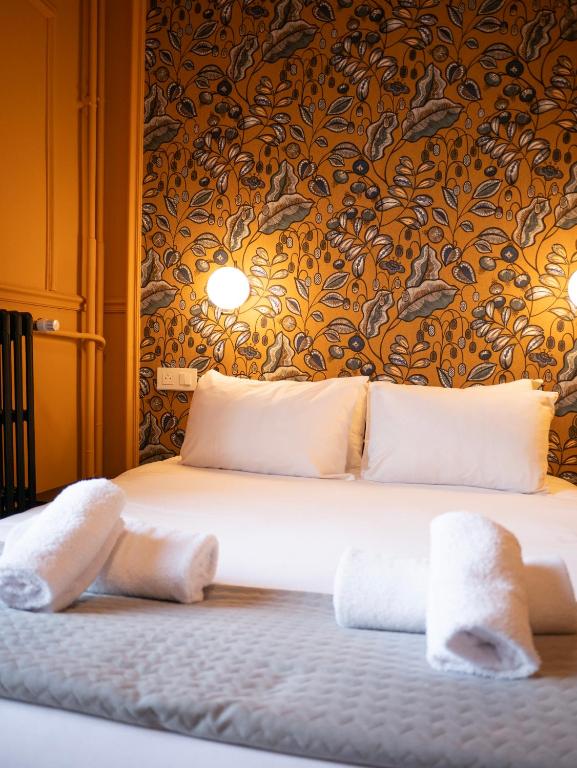 Posteľ alebo postele v izbe v ubytovaní Hôtel Gallia