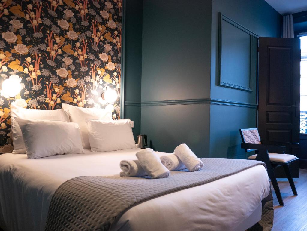 Posteľ alebo postele v izbe v ubytovaní Hôtel Gallia