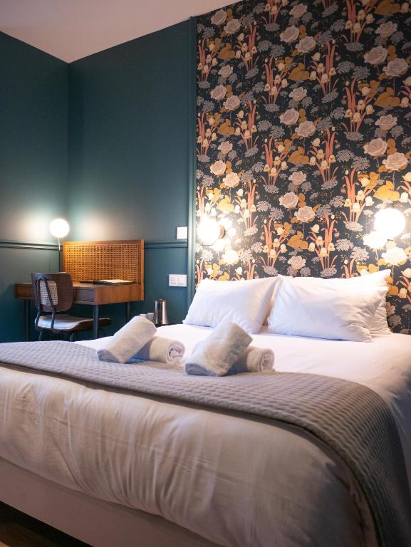Posteľ alebo postele v izbe v ubytovaní Hôtel Gallia