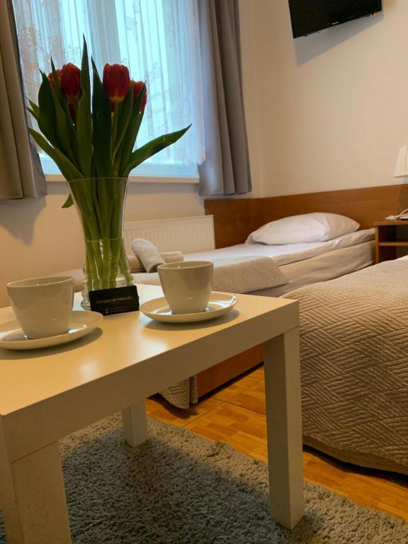 Postel nebo postele na pokoji v ubytování Pensjonat Melodia
