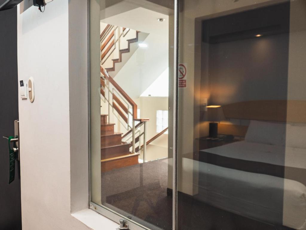 Ένα ή περισσότερα κρεβάτια σε δωμάτιο στο Hotel Ferré Miraflores