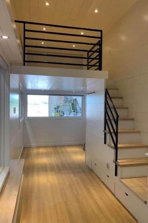 a room with a staircase and a stair case at chrisloner1992 in Paniqui