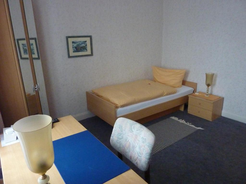 Postel nebo postele na pokoji v ubytování Hotel Oranien