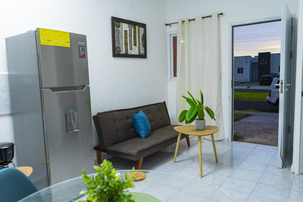 a living room with a couch and a table at Casa Oriente in San Miguel