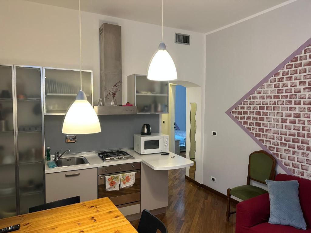 Kuchyň nebo kuchyňský kout v ubytování Room Principe