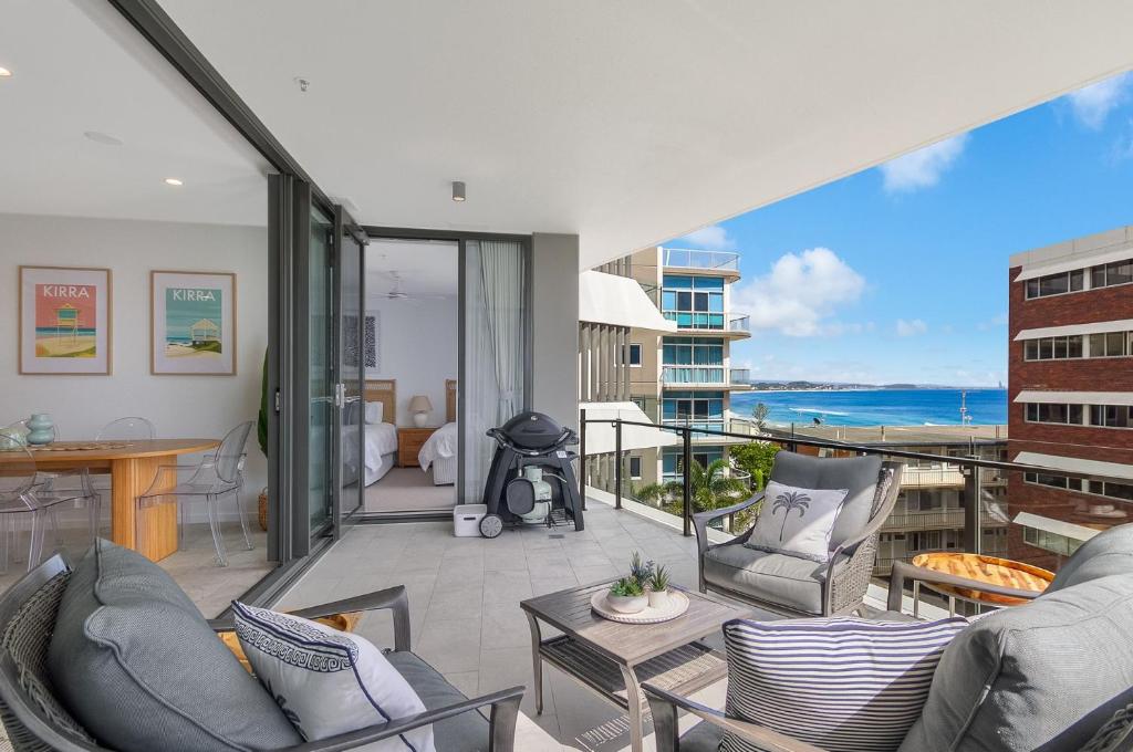 a living room with a balcony with a view of the ocean at Sol 803 in Gold Coast