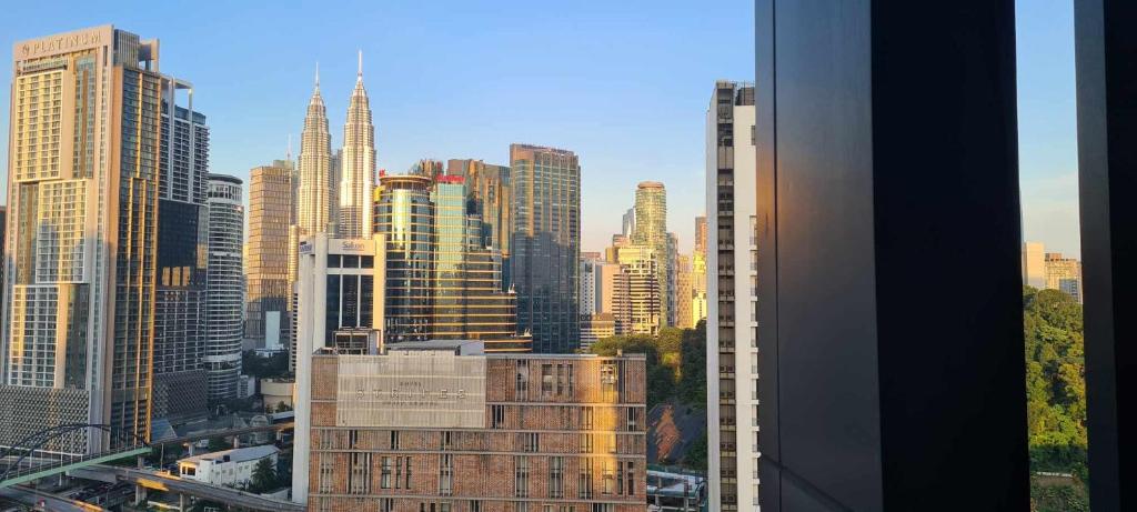 a view of a city skyline with tall buildings at Anggun Residences Luxe in Kuala Lumpur