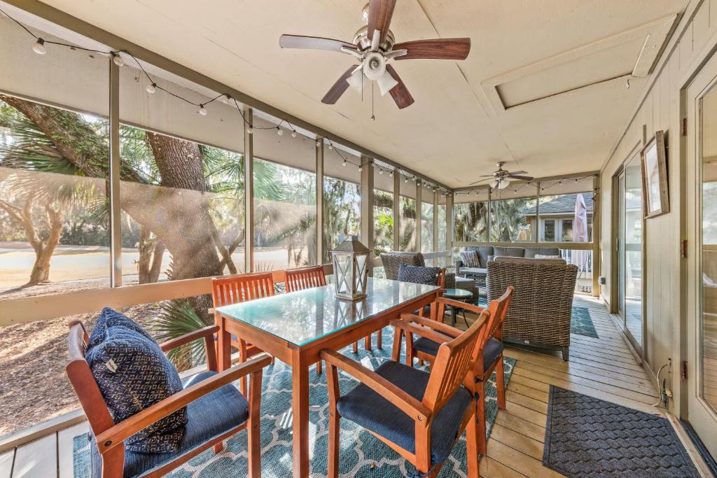 a dining room with a table and chairs at 1155 Summer Wind Ln in Jupiter