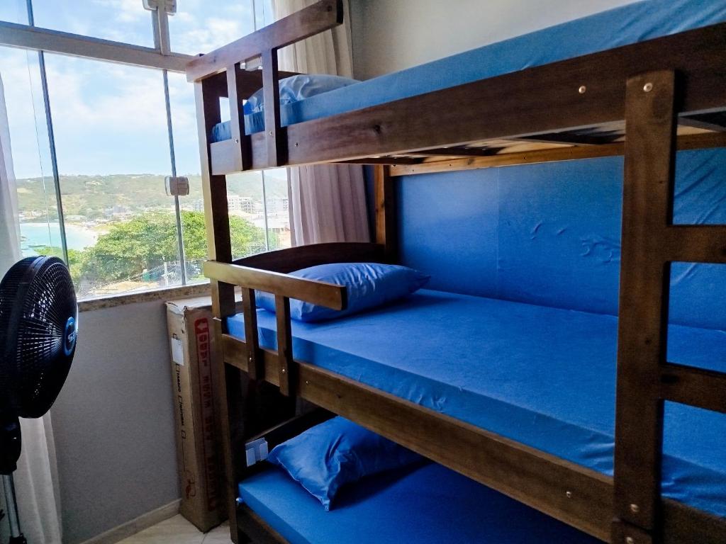 Palanda nebo palandy na pokoji v ubytování Hostel Casa da Pedra